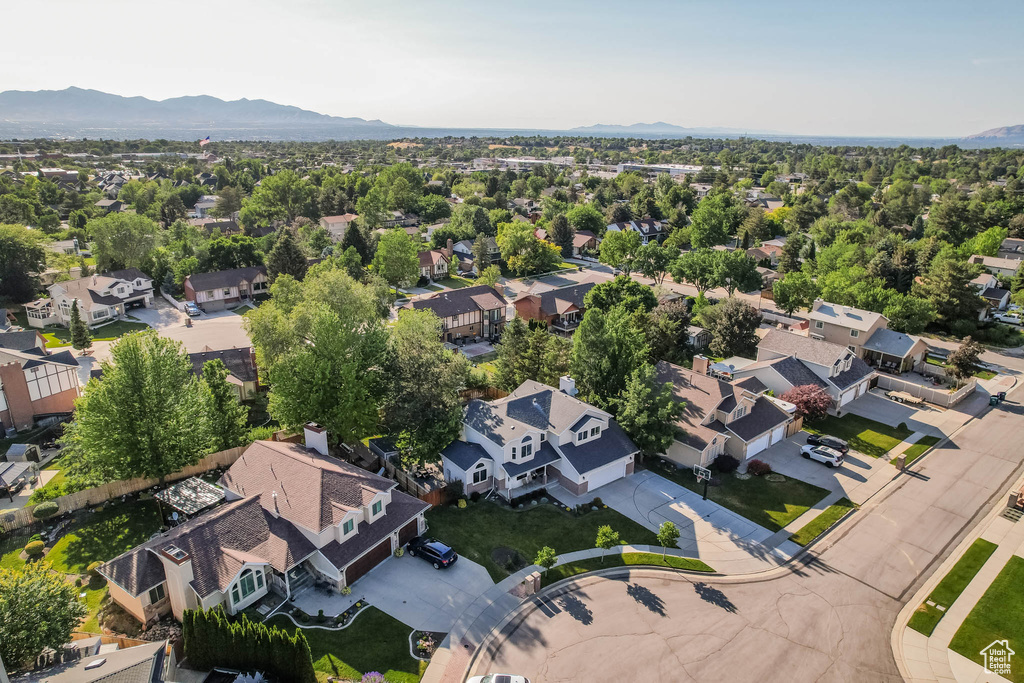 Aerial perspective of suburban area featuring a mountain backdrop