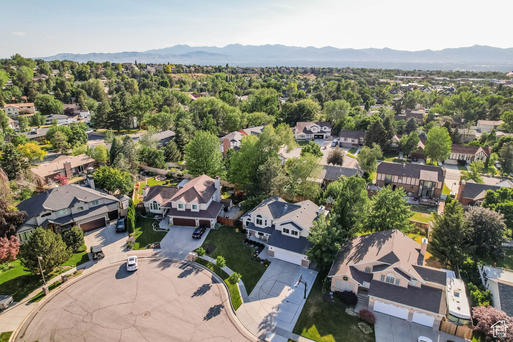 Aerial view of residential area featuring a mountainous background