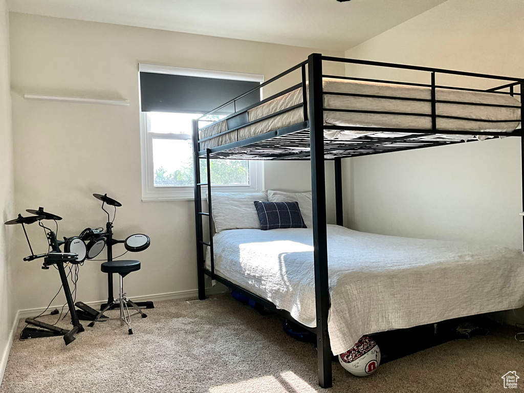 Carpeted bedroom with baseboards