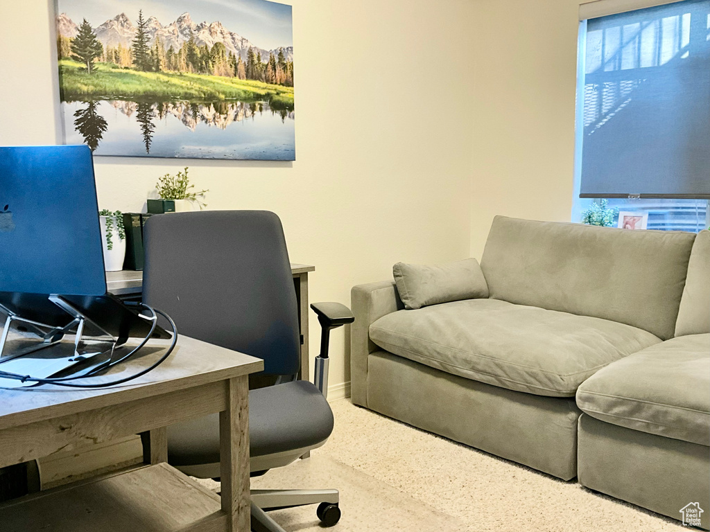 Office area featuring speckle patterned floor and baseboards