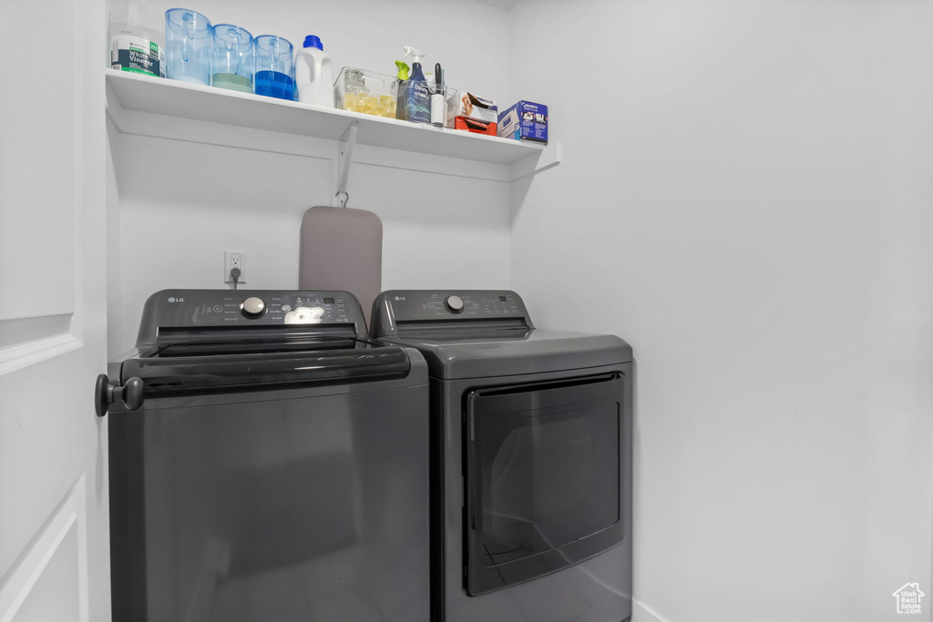 Washroom featuring separate washer and dryer