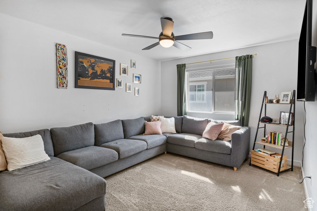 Living area featuring ceiling fan