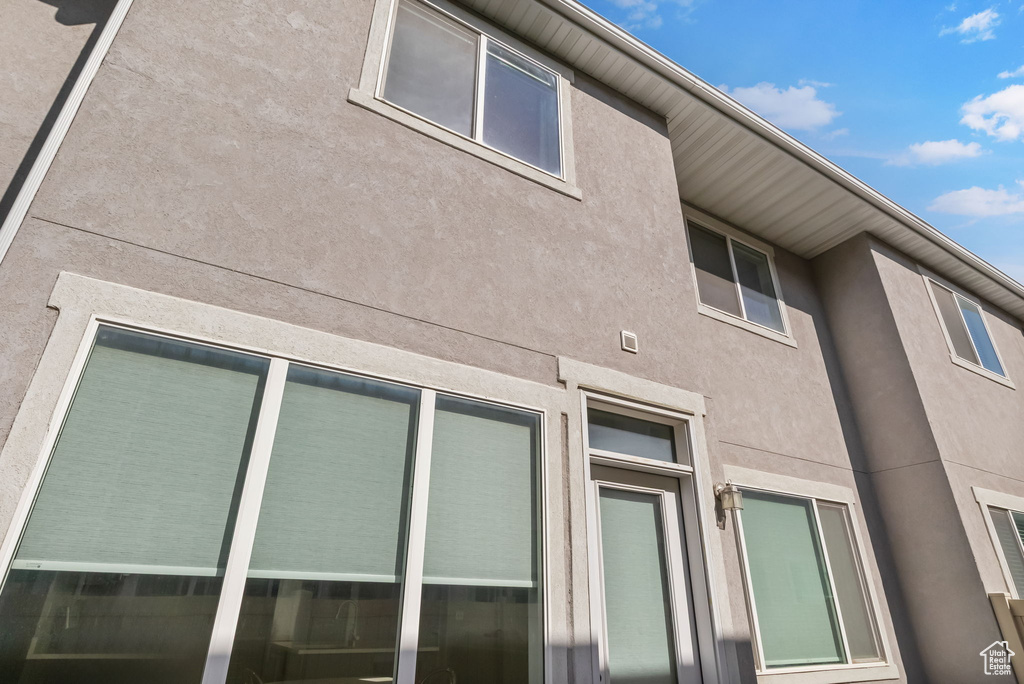 View of side of home with stucco siding