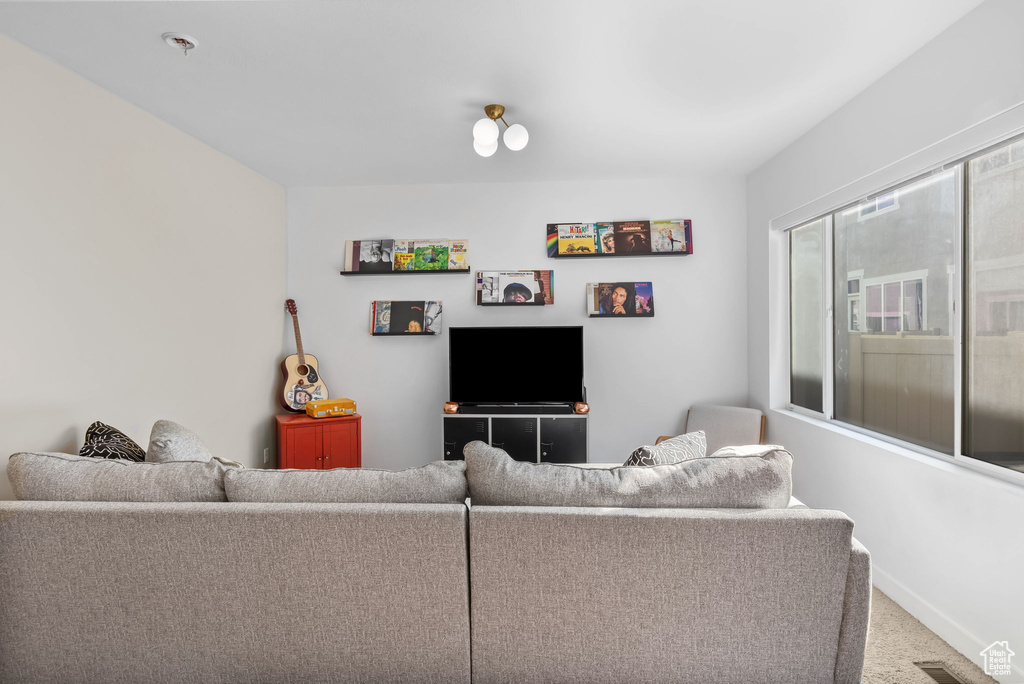 Living room featuring carpet floors and baseboards
