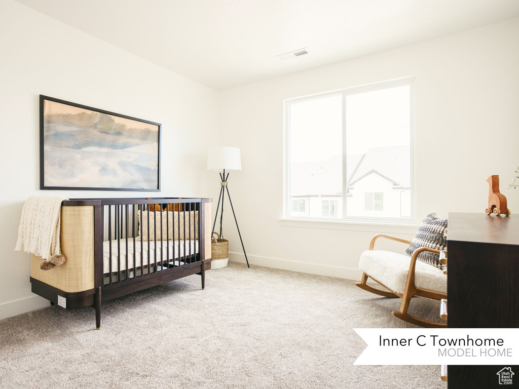 Carpeted bedroom with baseboards