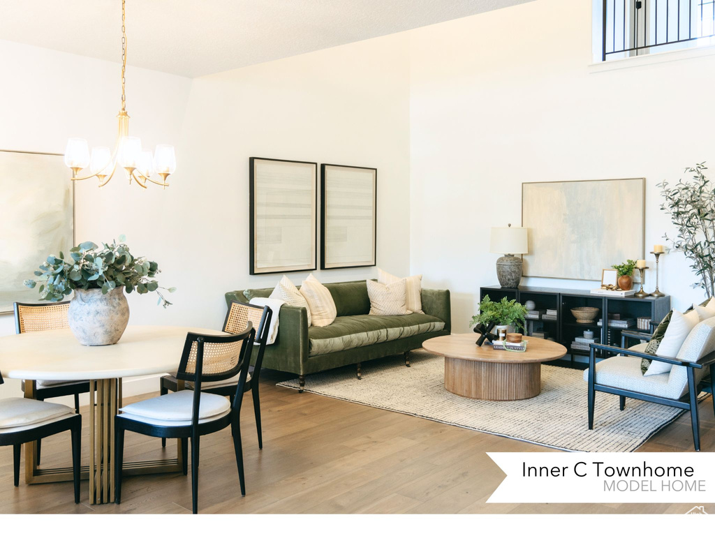 Living room with a chandelier and light wood-style flooring