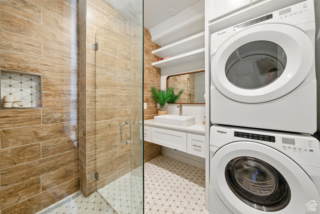 Laundry area with stacked washer / drying machine