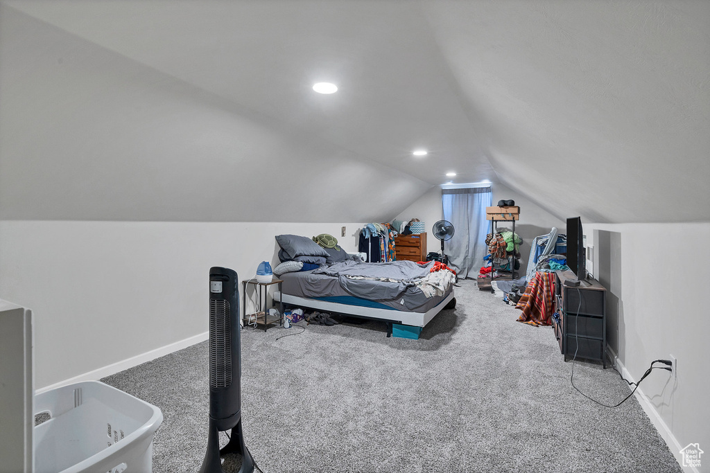 Bedroom with vaulted ceiling, carpet flooring, baseboards, and recessed lighting