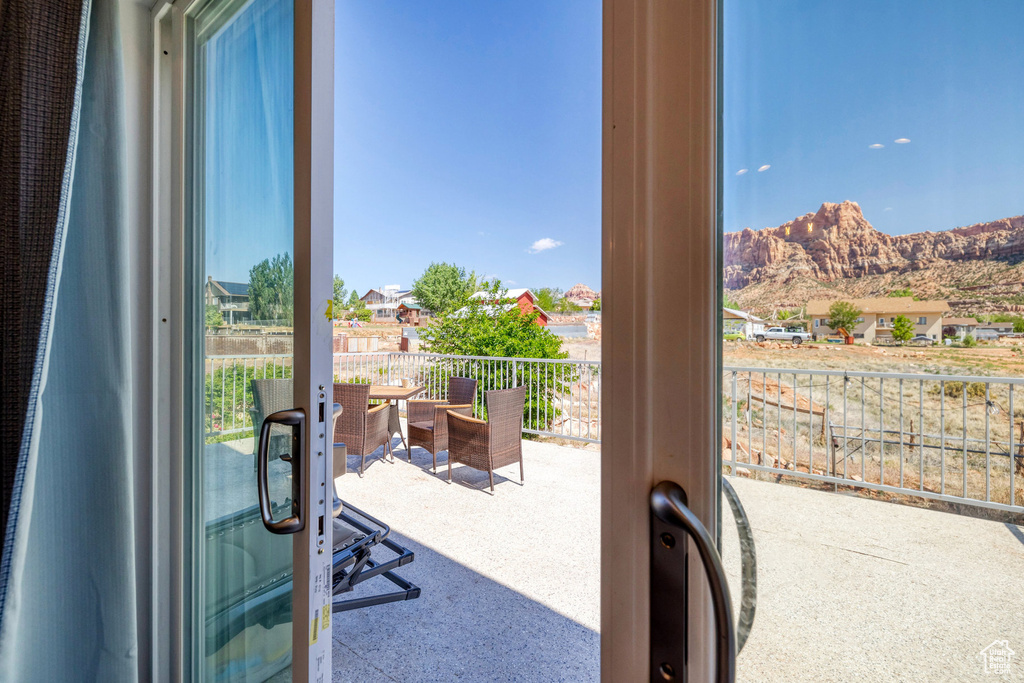 Entryway featuring french doors and a mountain view