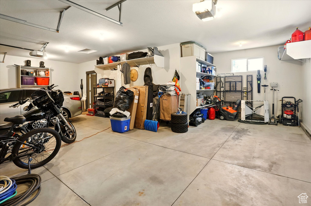 Garage featuring a garage door opener