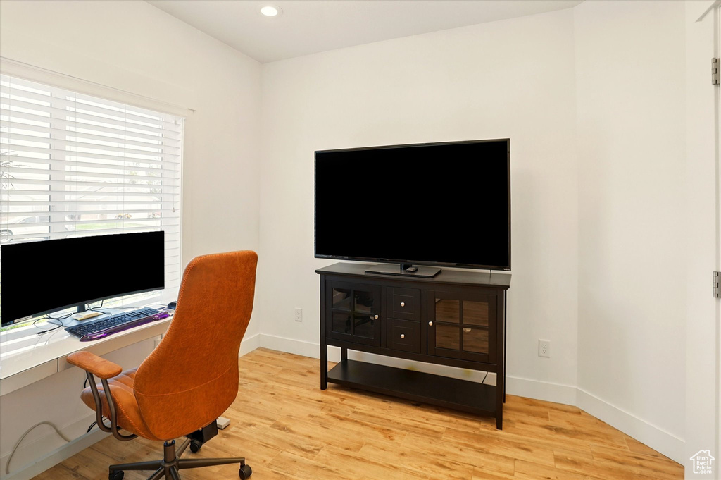 Home office featuring light wood-type flooring, baseboards, and recessed lighting