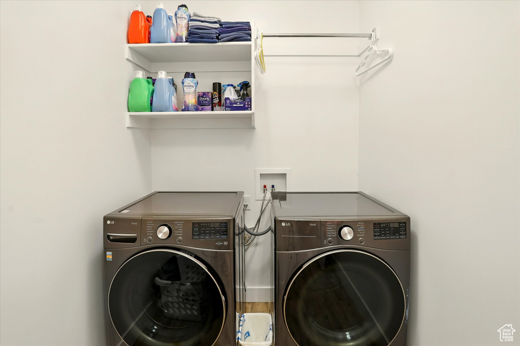 Washroom featuring washer and clothes dryer