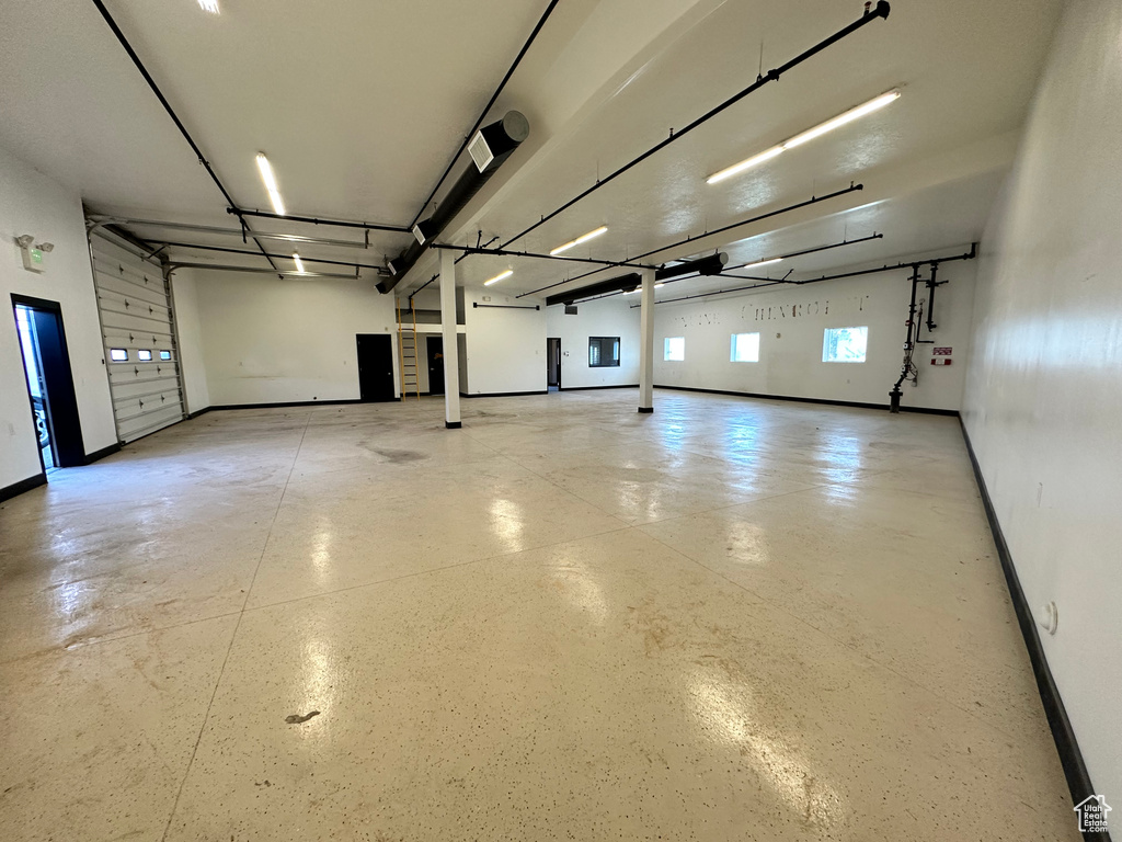 Garage featuring baseboards