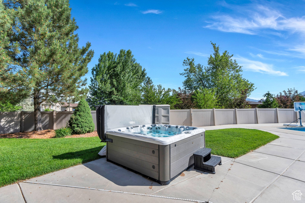 View of patio / terrace with a hot tub