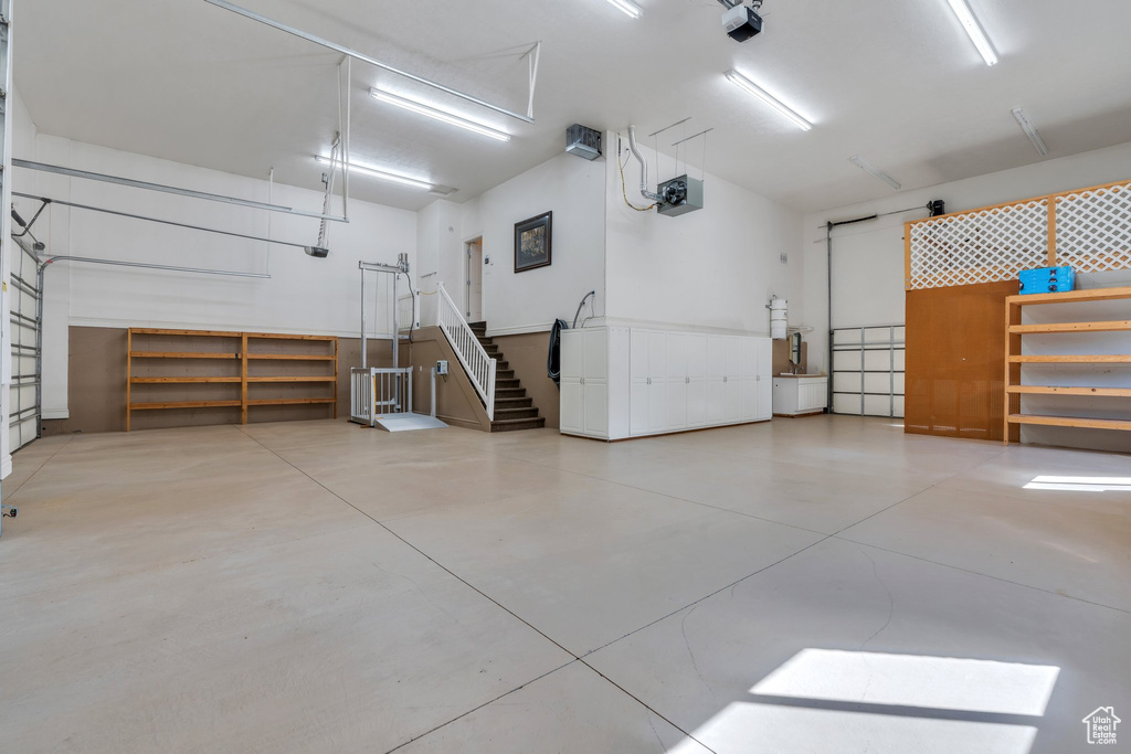 Garage featuring a garage door opener