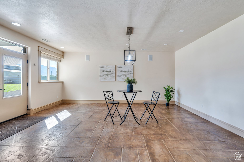 Dining space featuring baseboards and recessed lighting