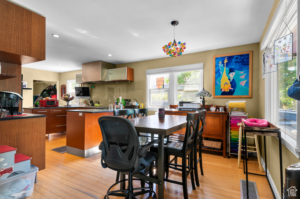 Dining area featuring light wood-style floors and recessed lighting