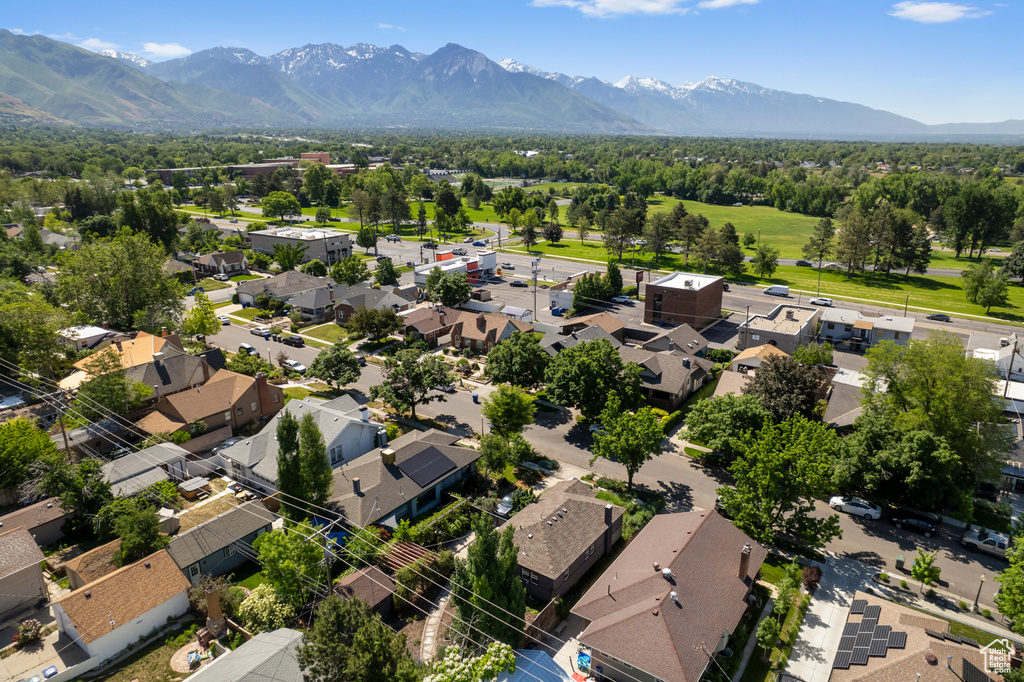 Aerial perspective of suburban area with a mountainous background
