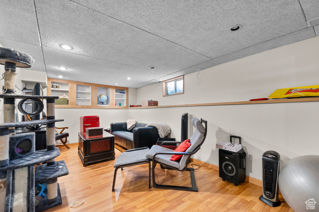 Living room featuring wood finished floors, baseboards, and recessed lighting