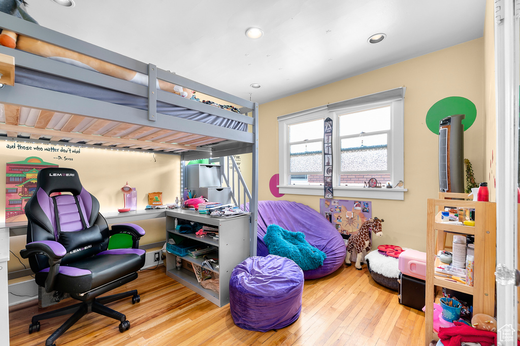 Bedroom featuring hardwood / wood-style floors and recessed lighting