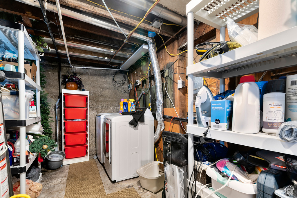 Unfinished basement featuring washing machine and dryer