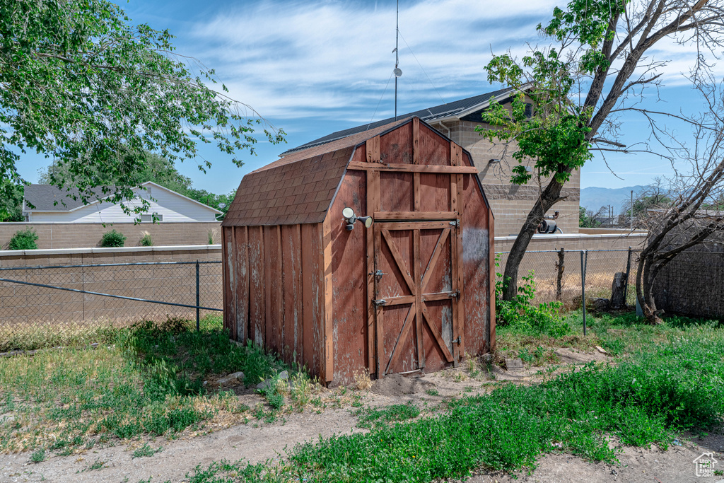 View of shed featuring a fenced backyard