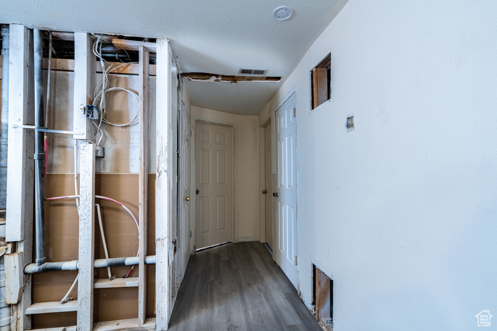 Hallway featuring wood finished floors