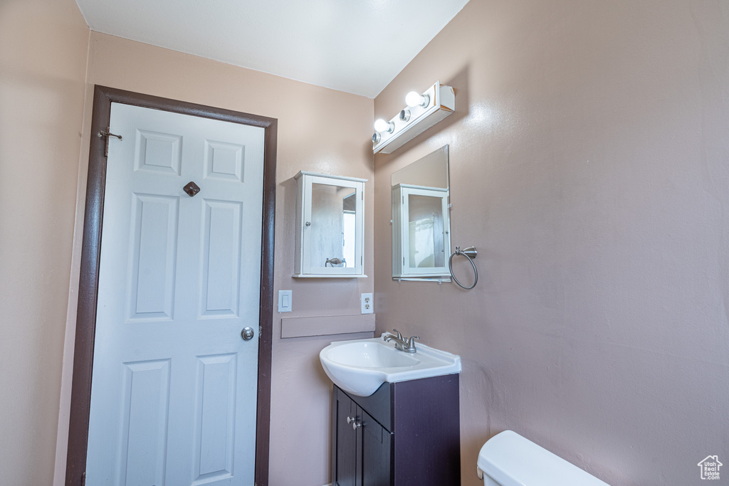 Bathroom featuring toilet and vanity