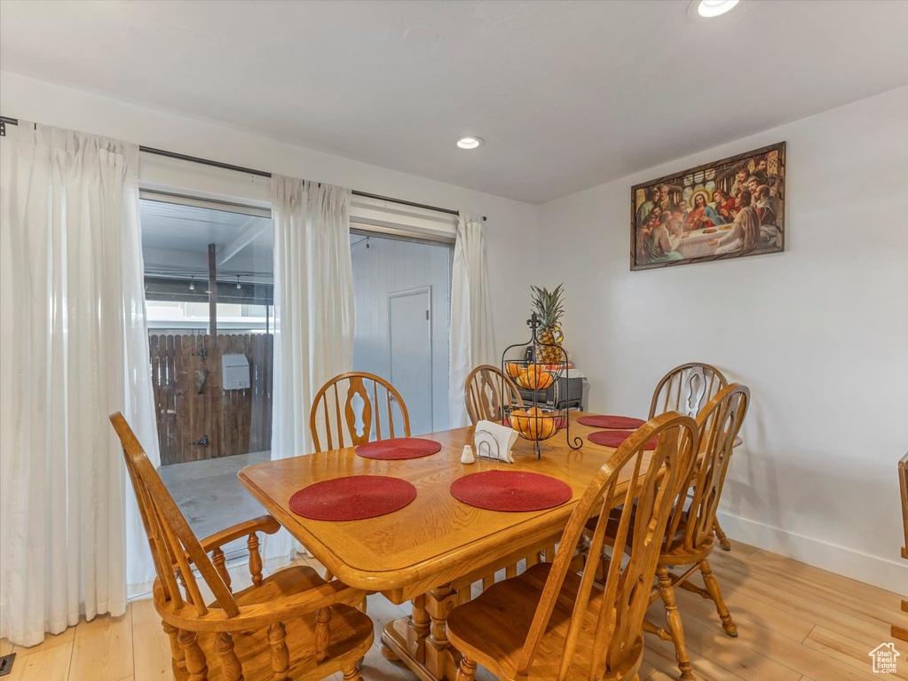 Dining space featuring light wood-style flooring, recessed lighting, and baseboards