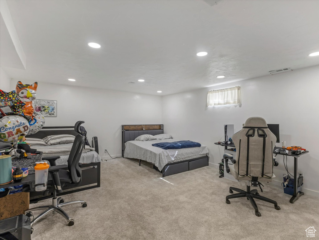 Carpeted bedroom with recessed lighting and baseboards