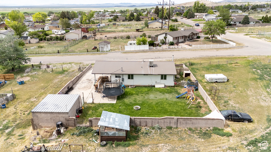 Aerial perspective of suburban area with a mountainous background