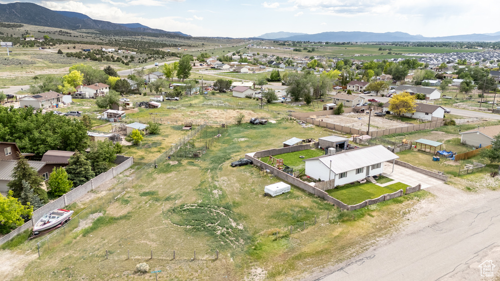 Aerial view of residential area featuring a mountain backdrop