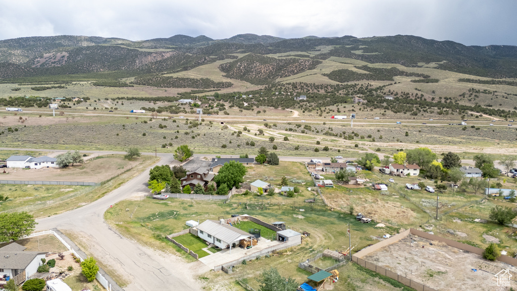 Aerial view of property's location with a mountain backdrop and rural landscape