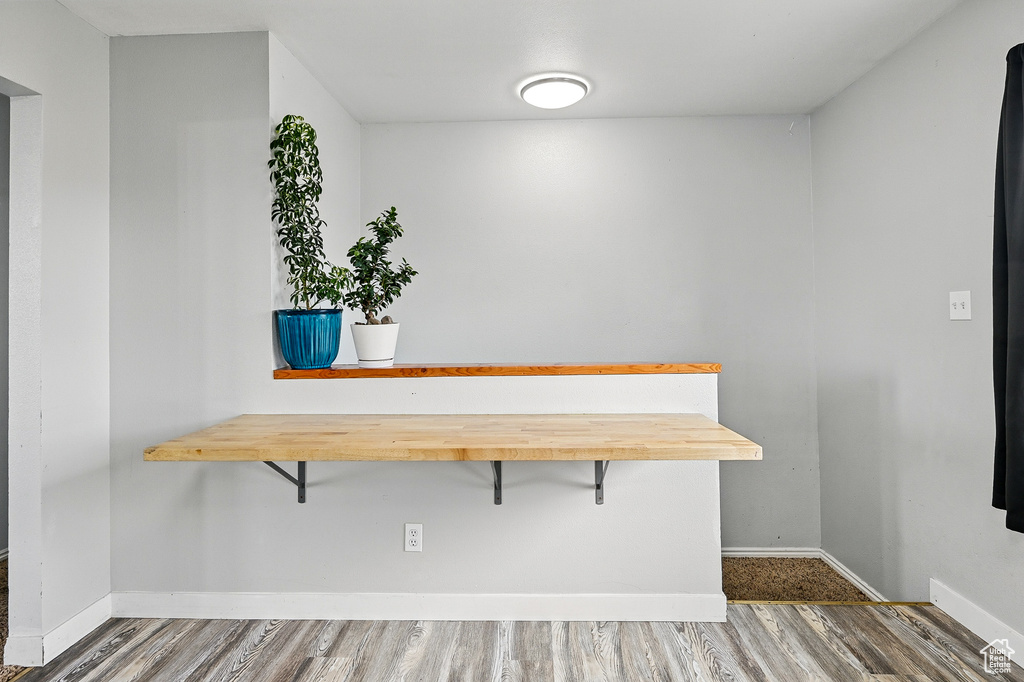 Detailed view of wood finished floors and baseboards