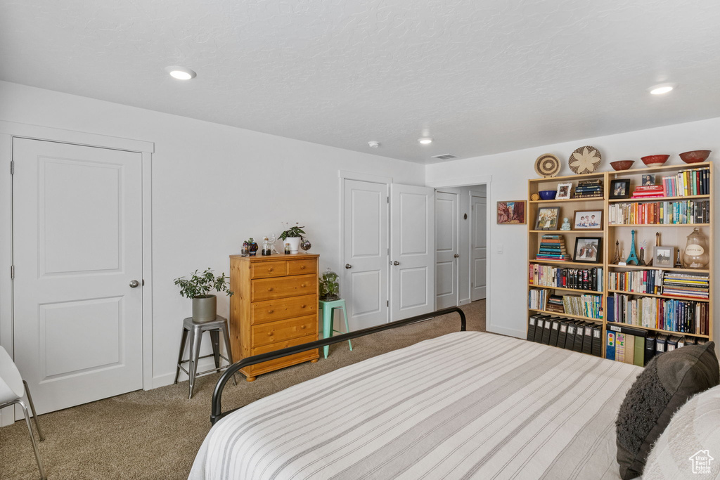 Bedroom with carpet floors, recessed lighting, and baseboards