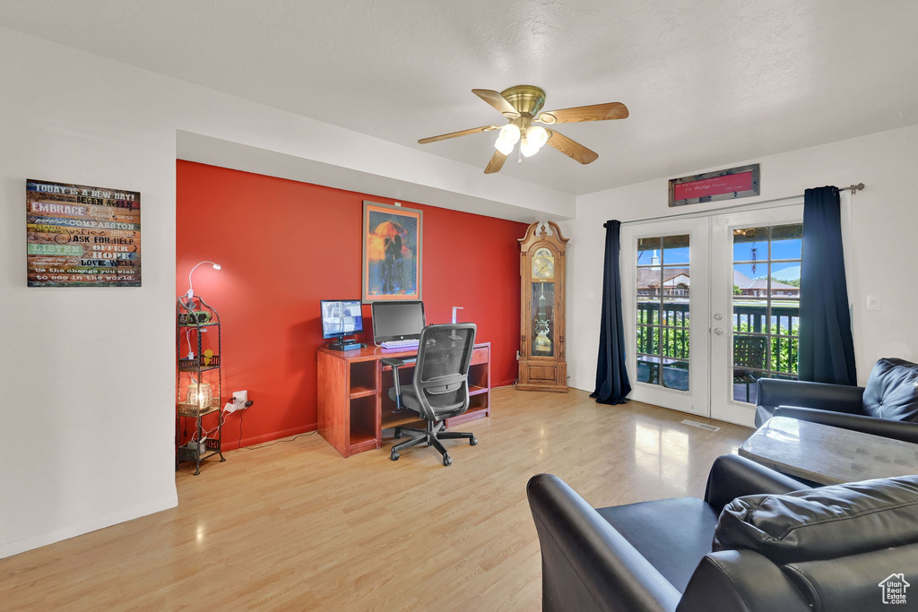 Office with french doors, wood finished floors, a ceiling fan, and baseboards