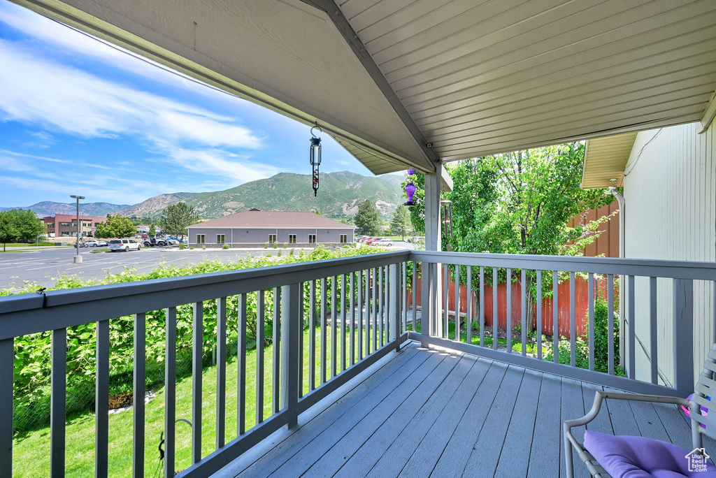 Wooden deck featuring a mountain view