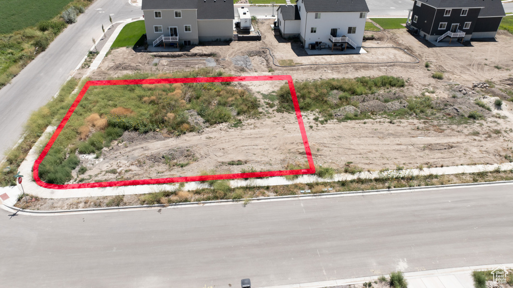 Aerial view of property and surrounding area with property boundaries highlighted