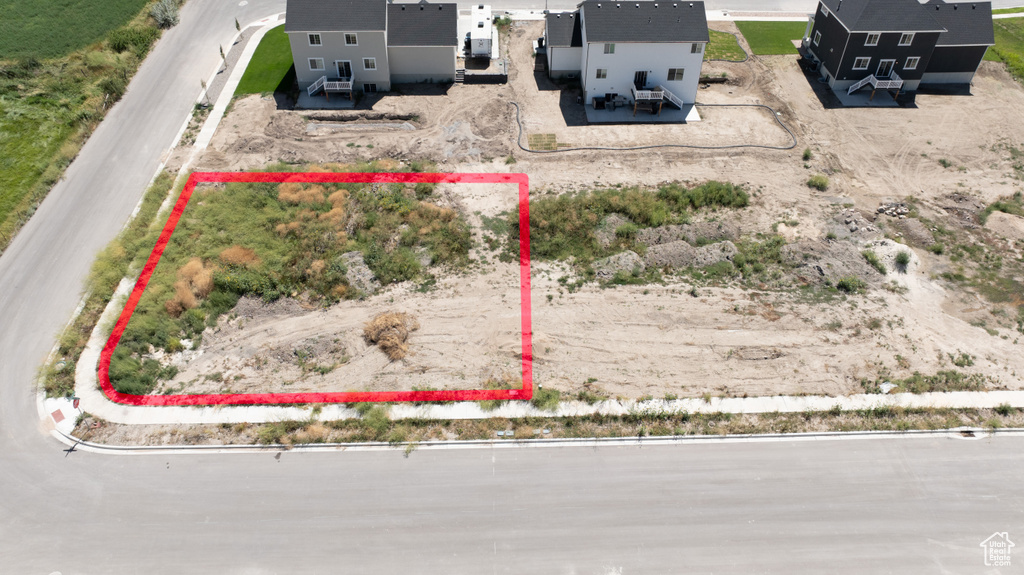 Aerial view of property and surrounding area featuring property parcel outlined