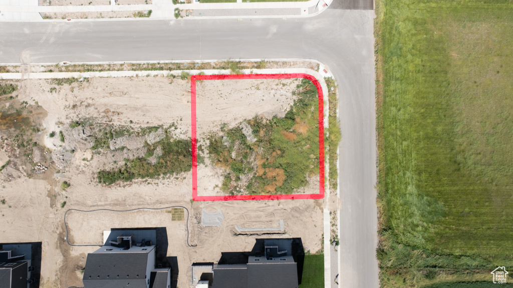 Aerial view of property and surrounding area with property parcel outlined