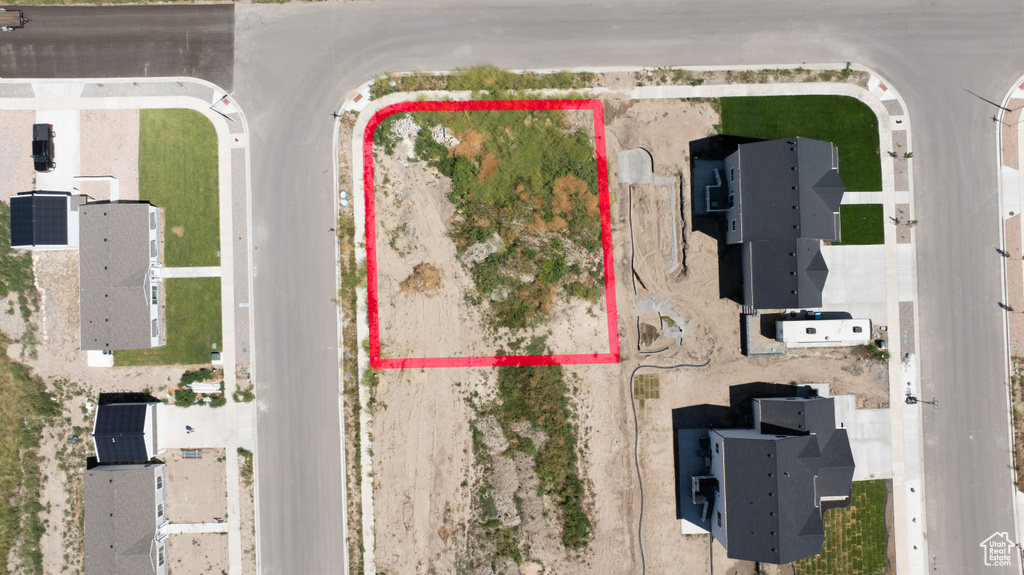 Aerial view of property and surrounding area featuring property parcel outlined