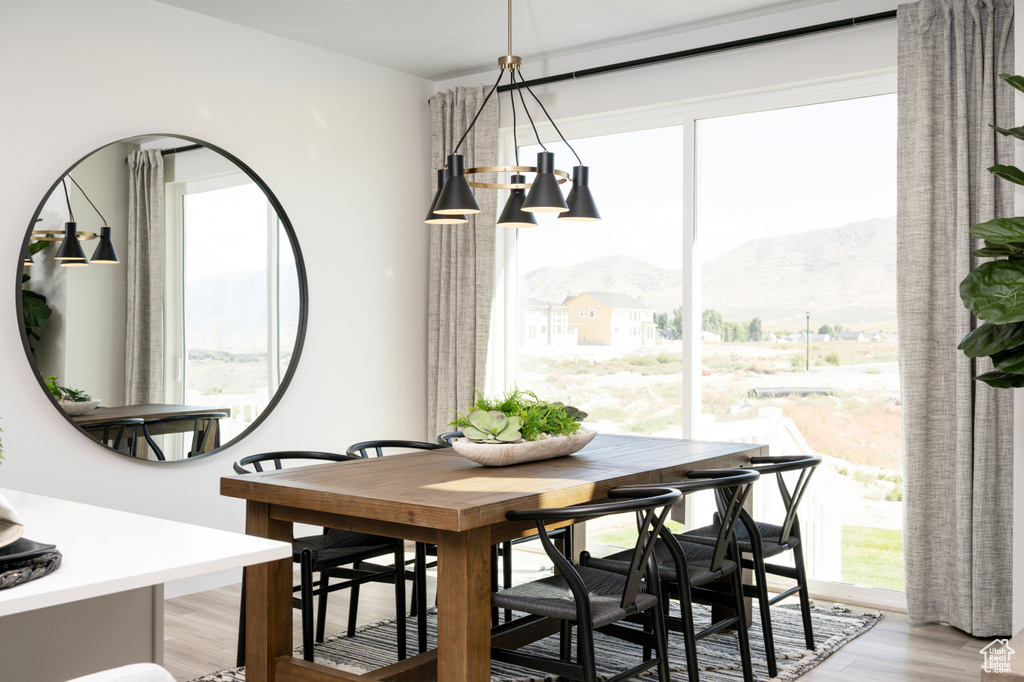Dining space featuring a mountain view and light wood-style floors