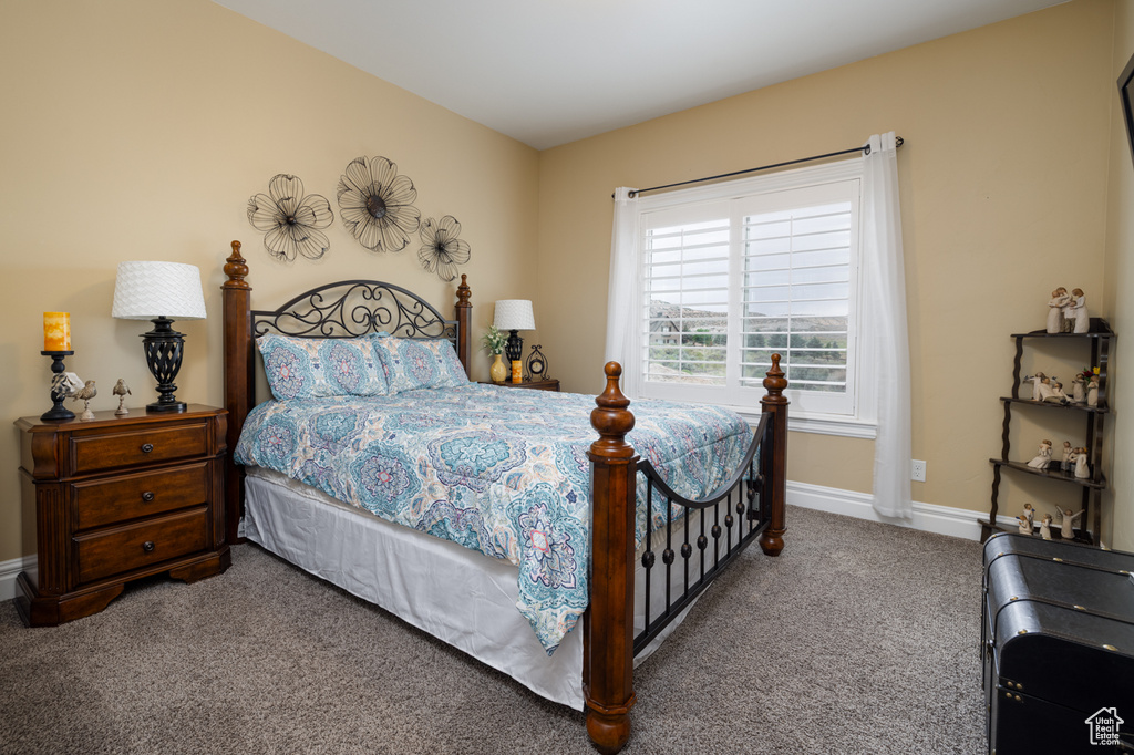 Bedroom with carpet flooring and baseboards