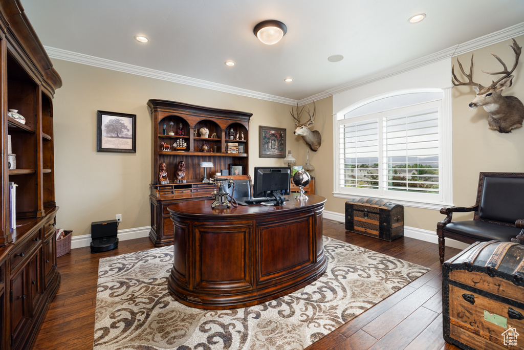 Office featuring dark wood-type flooring, ornamental molding, recessed lighting, and baseboards
