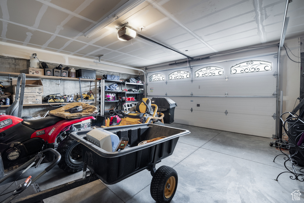 Garage featuring a garage door opener