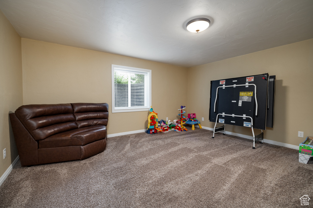 Playroom with carpet flooring and baseboards