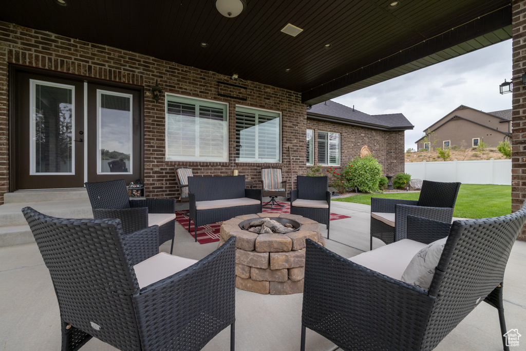View of patio / terrace with an outdoor living space with a fire pit