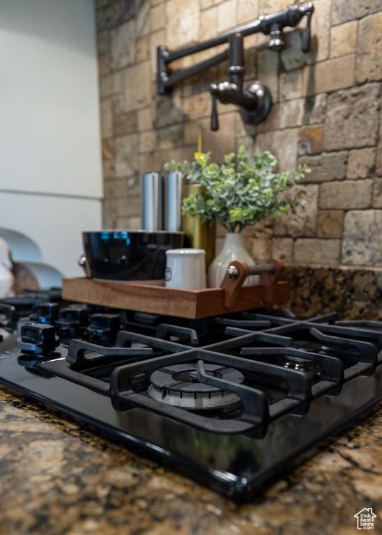 Kitchen view of black gas stovetop
