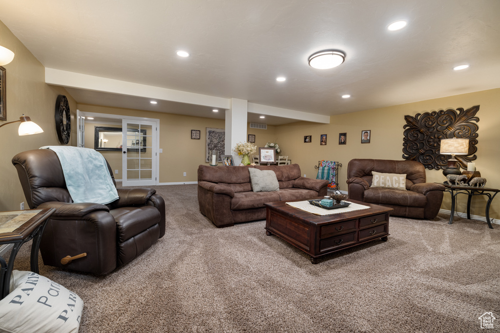 Living room with carpet flooring, baseboards, and recessed lighting