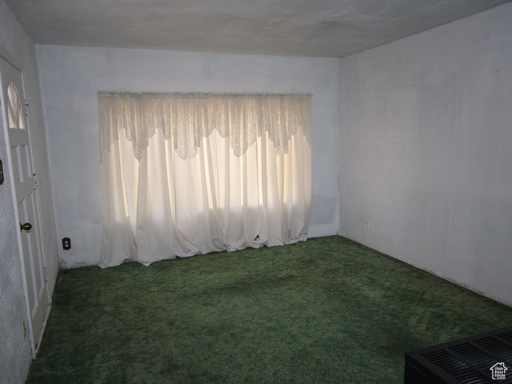 Spare room featuring carpet